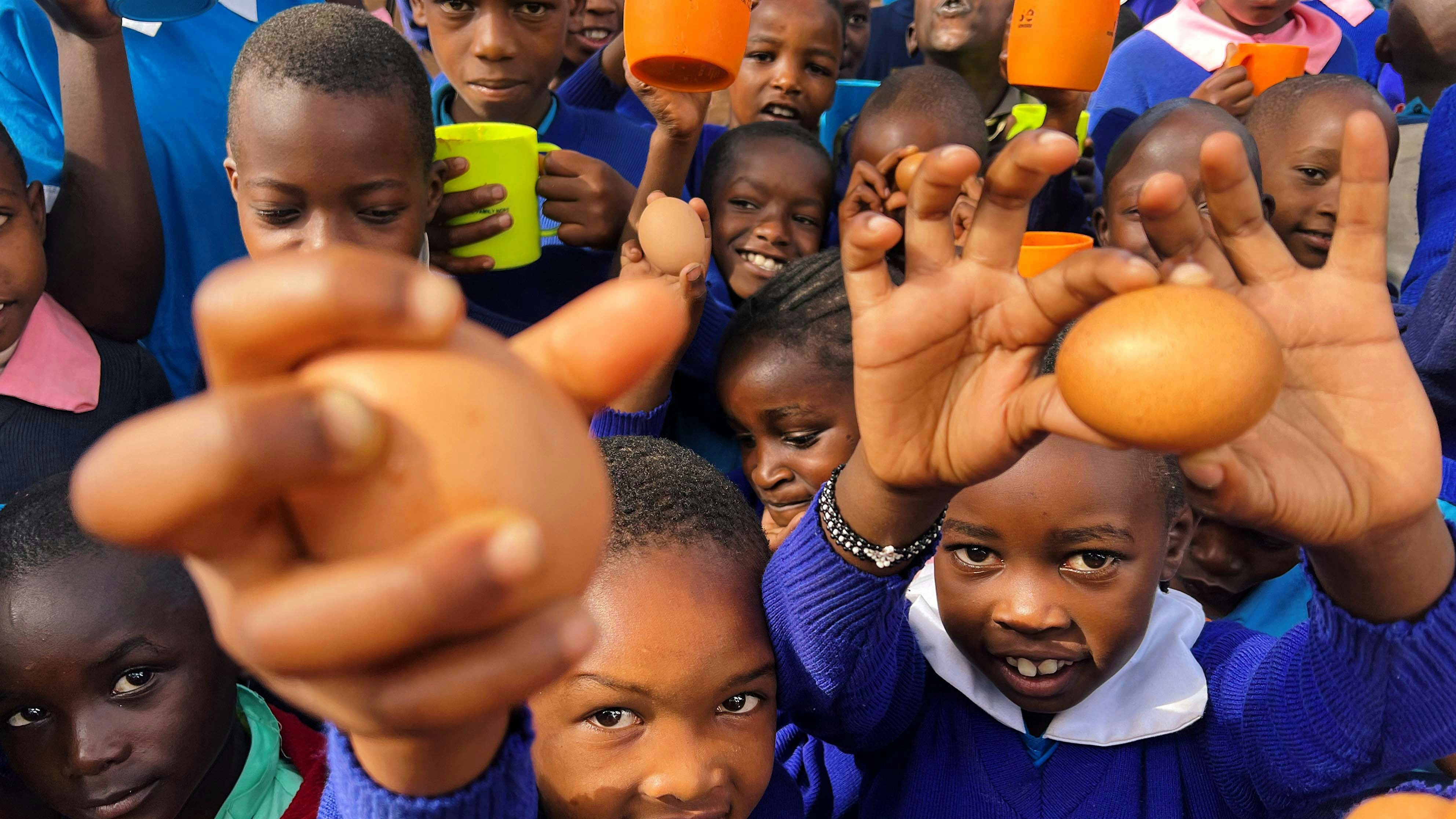 Children holding eggs in Kenya