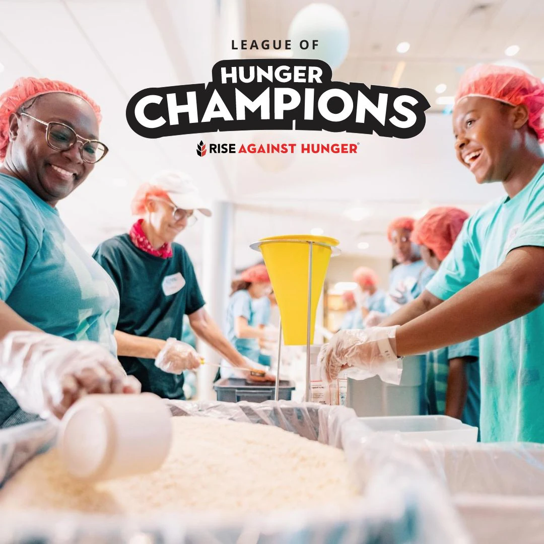 Volunteers packaging meals