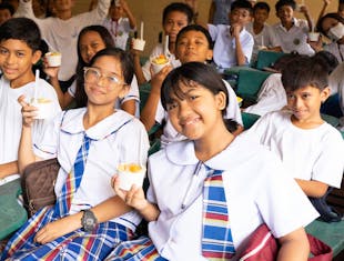 Students eating a meal in the Philippines
